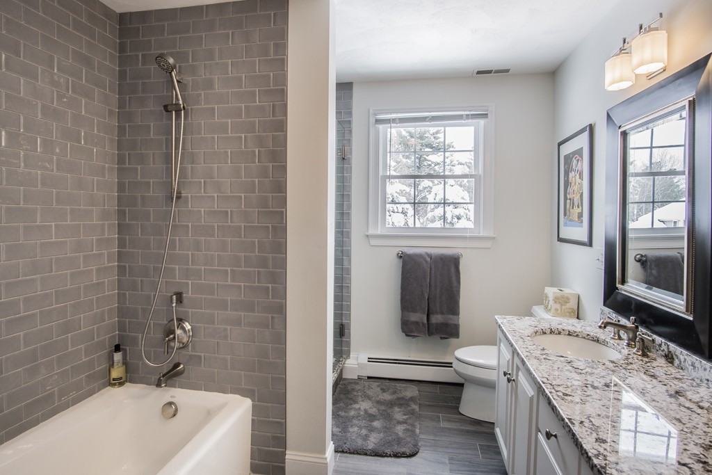 16 Somerset Drive Andover, MA 01810 - Photo 22 of 30 a bathroom with a granite countertop sink a toilet and shower