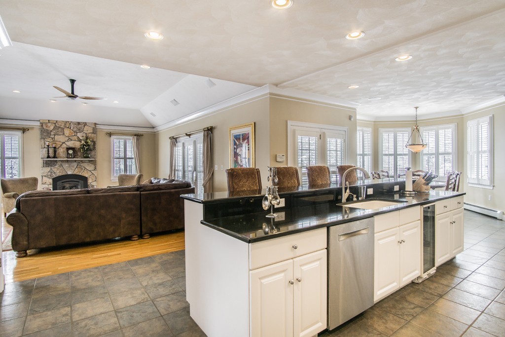 16 Somerset Drive Andover, MA 01810 - Photo 5 of 30 a kitchen with granite countertop a sink and white cabinets