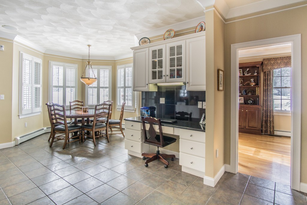 16 Somerset Drive Andover, MA 01810 - Photo 7 of 30 a dining room with furniture a chandelier and kitchen view