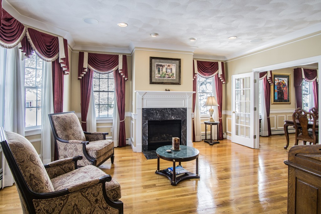 16 Somerset Drive Andover, MA 01810 - Photo 10 of 30 a living room with furniture and a fireplace