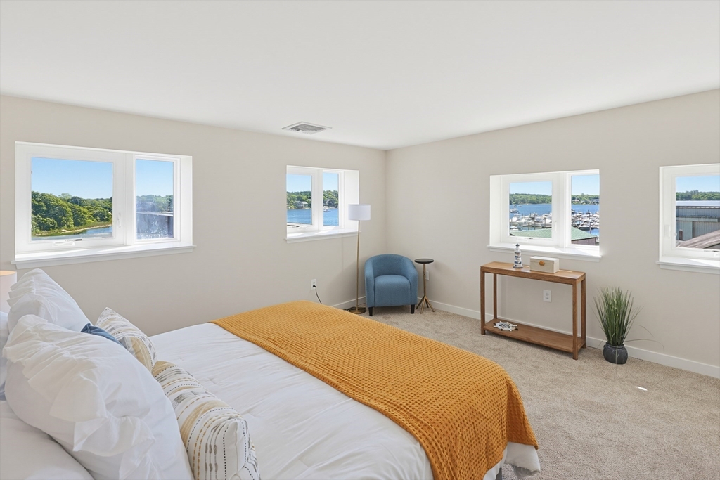 45 Main Street, Unit 35 Wareham, MA 02571 - Photo 19 of 34 a bedroom with a bed and a window