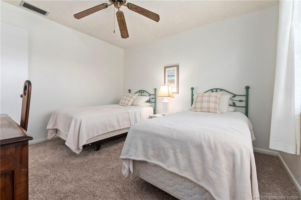 1951 Southwest Palm City Road, Unit 26F Stuart, FL 34994 - Photo 7 of 20 a bedroom with bed and window