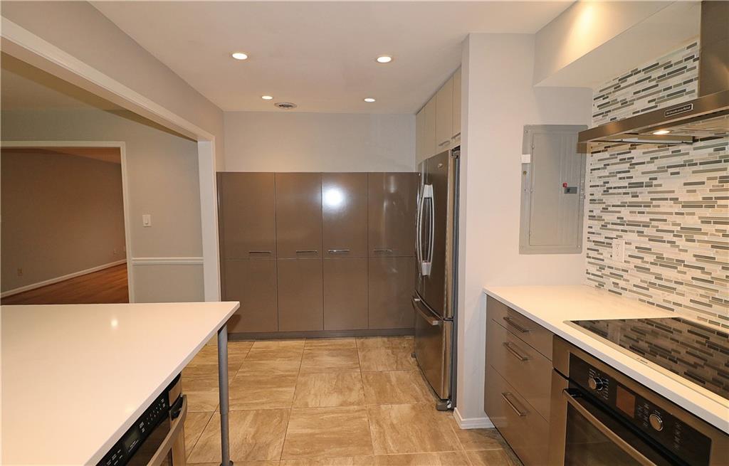 40 Glenald Way Northwest Atlanta, GA 30327 - Photo 11 of 35 a kitchen with a sink stove and cabinets