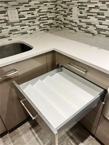 a close view of sink and washing machine