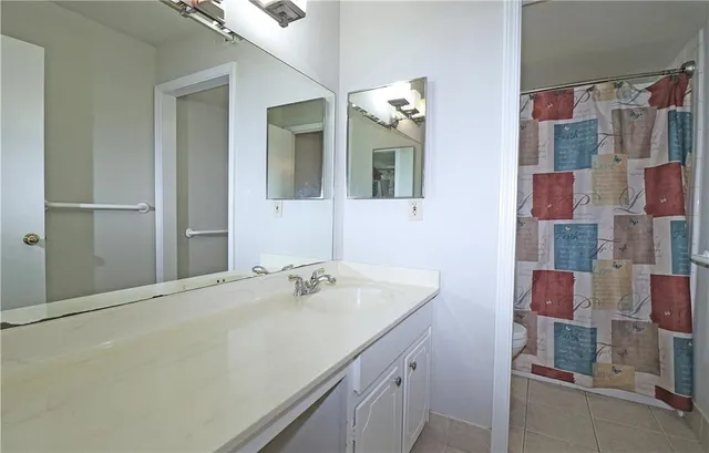 a bathroom with a shower and a toilet