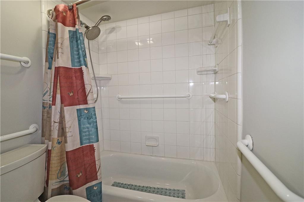 40 Glenald Way Northwest Atlanta, GA 30327 - Photo 21 of 35 a bathroom with a shower and a toilet