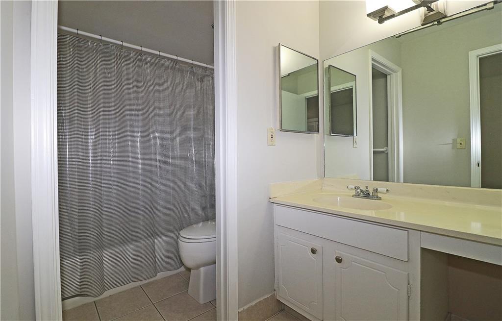 40 Glenald Way Northwest Atlanta, GA 30327 - Photo 22 of 35 a bathroom with a granite countertop sink toilet and shower