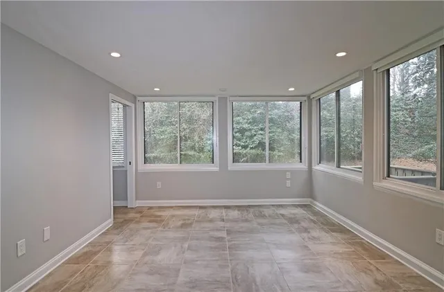 a view of an empty room with a window