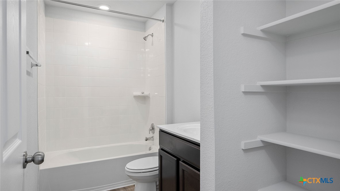 2317 Saffron Road Temple, TX 76501 - Photo 21 of 22 a bathroom with a sink a toilet and shower