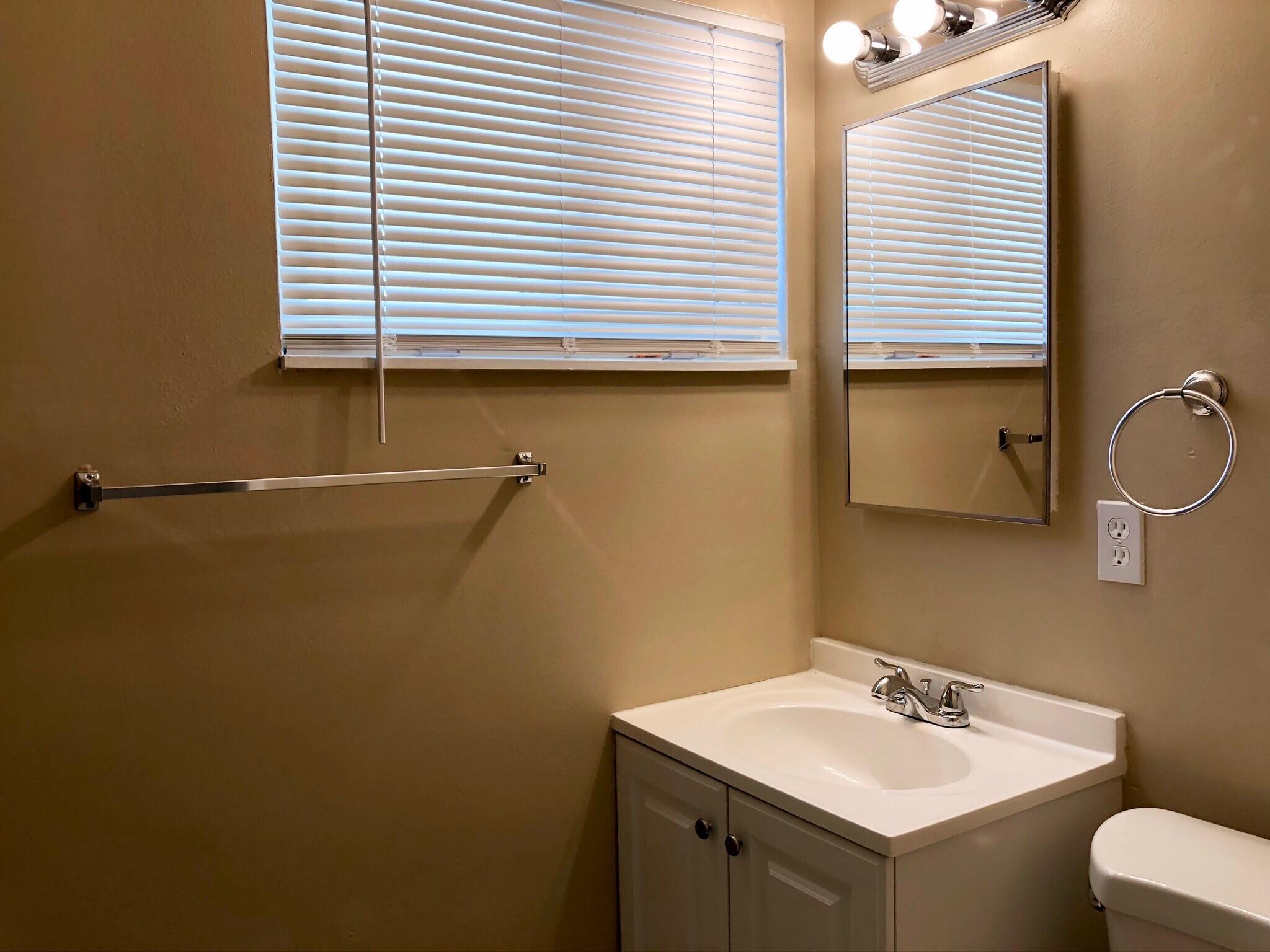 81104 Francis Avenue Indio, CA 92201 - Photo 14 of 23 a bathroom with a sink and a mirror