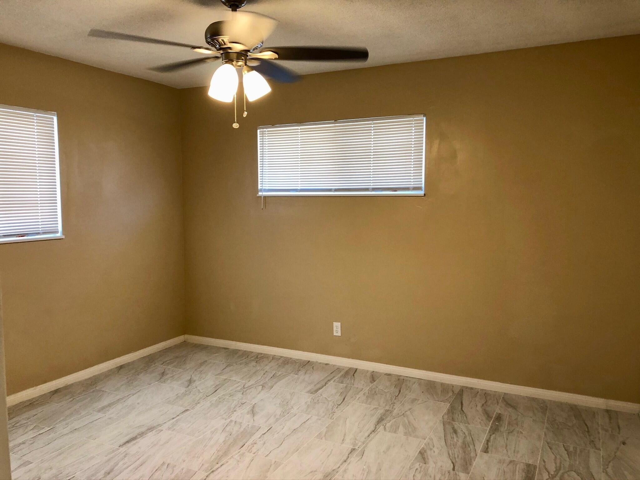 81104 Francis Avenue Indio, CA 92201 - Photo 16 of 23 a view of a room with a chandelier fan