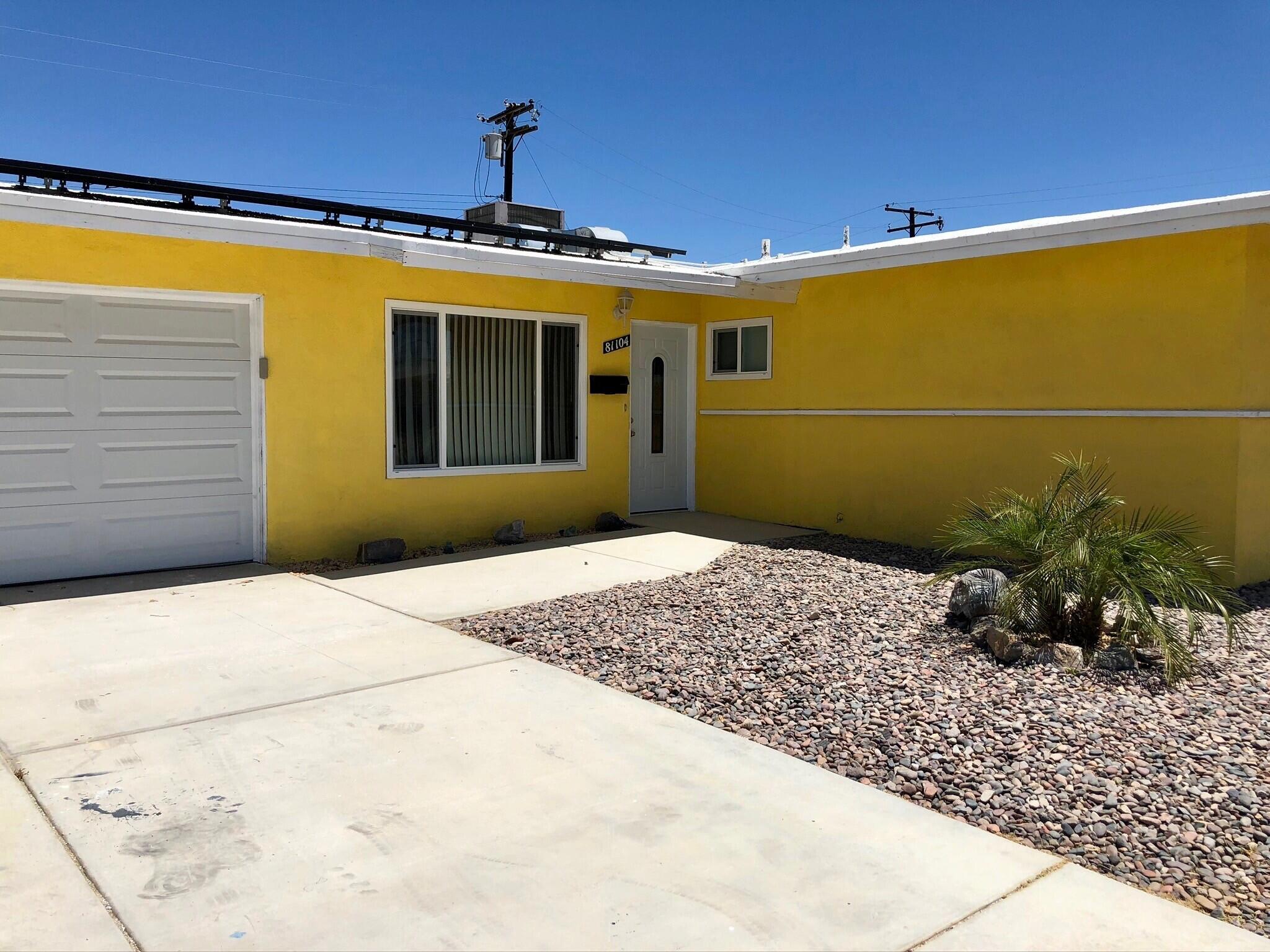 81104 Francis Avenue Indio, CA 92201 - Photo 3 of 23 a front view of a house