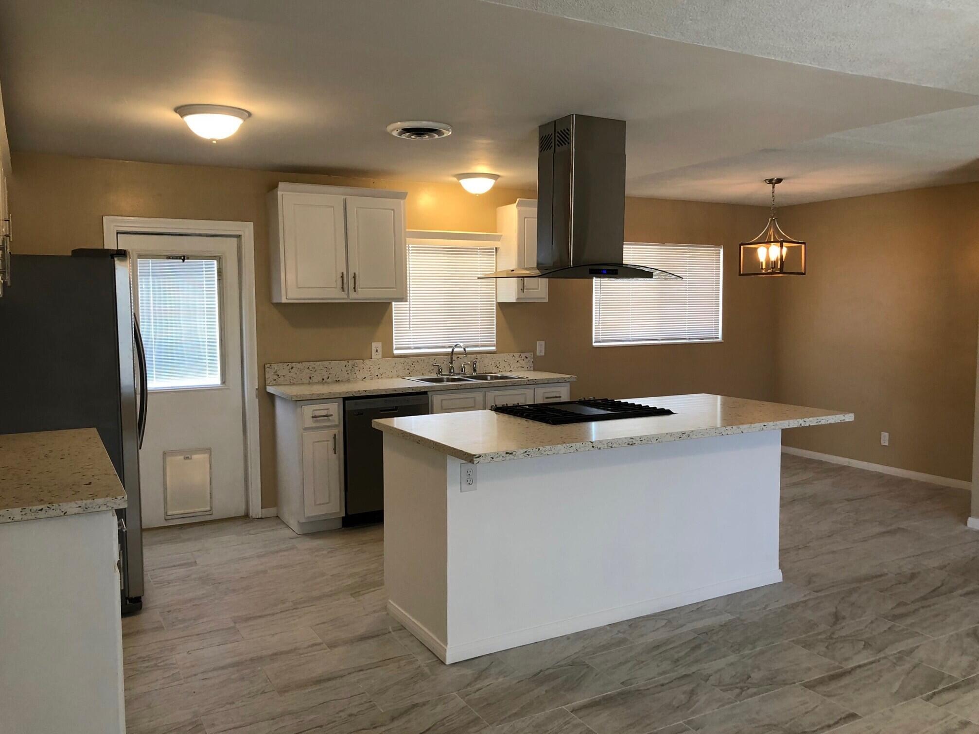 81104 Francis Avenue Indio, CA 92201 - Photo 5 of 23 a kitchen with a sink cabinets and stainless steel appliances