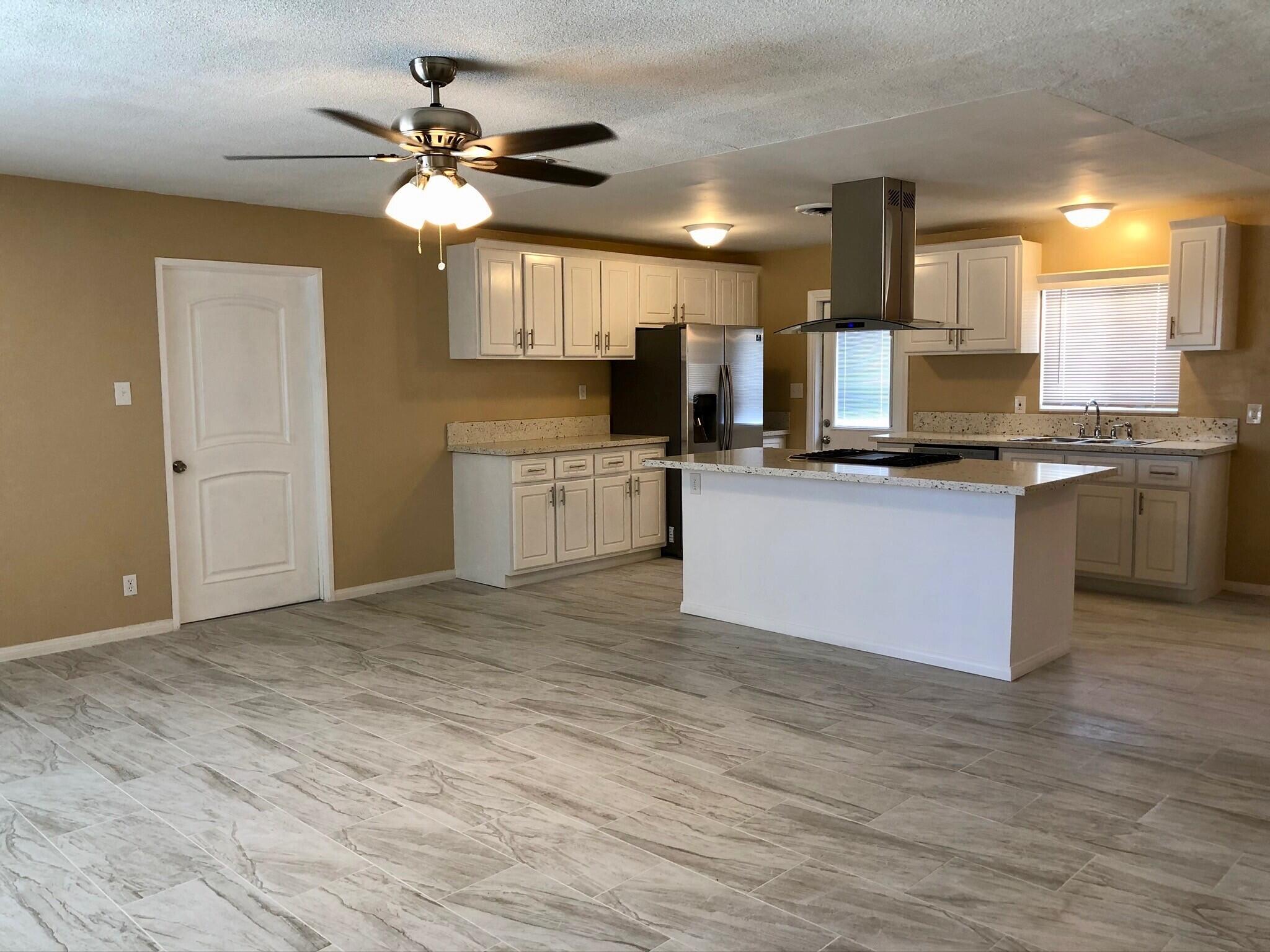 81104 Francis Avenue Indio, CA 92201 - Photo 6 of 23 a kitchen with stainless steel appliances granite countertop a stove and a sink