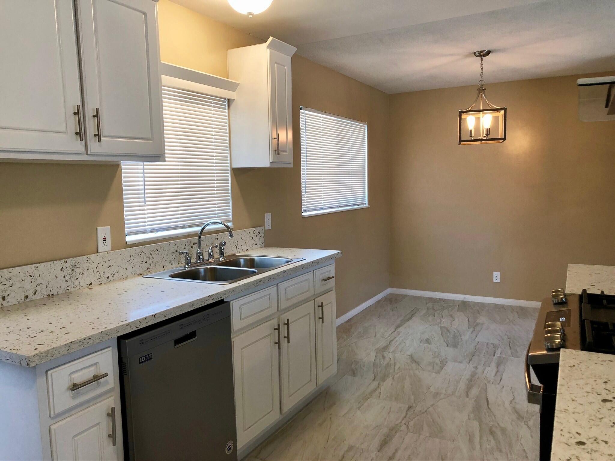 81104 Francis Avenue Indio, CA 92201 - Photo 9 of 23 a kitchen with a sink cabinets and window