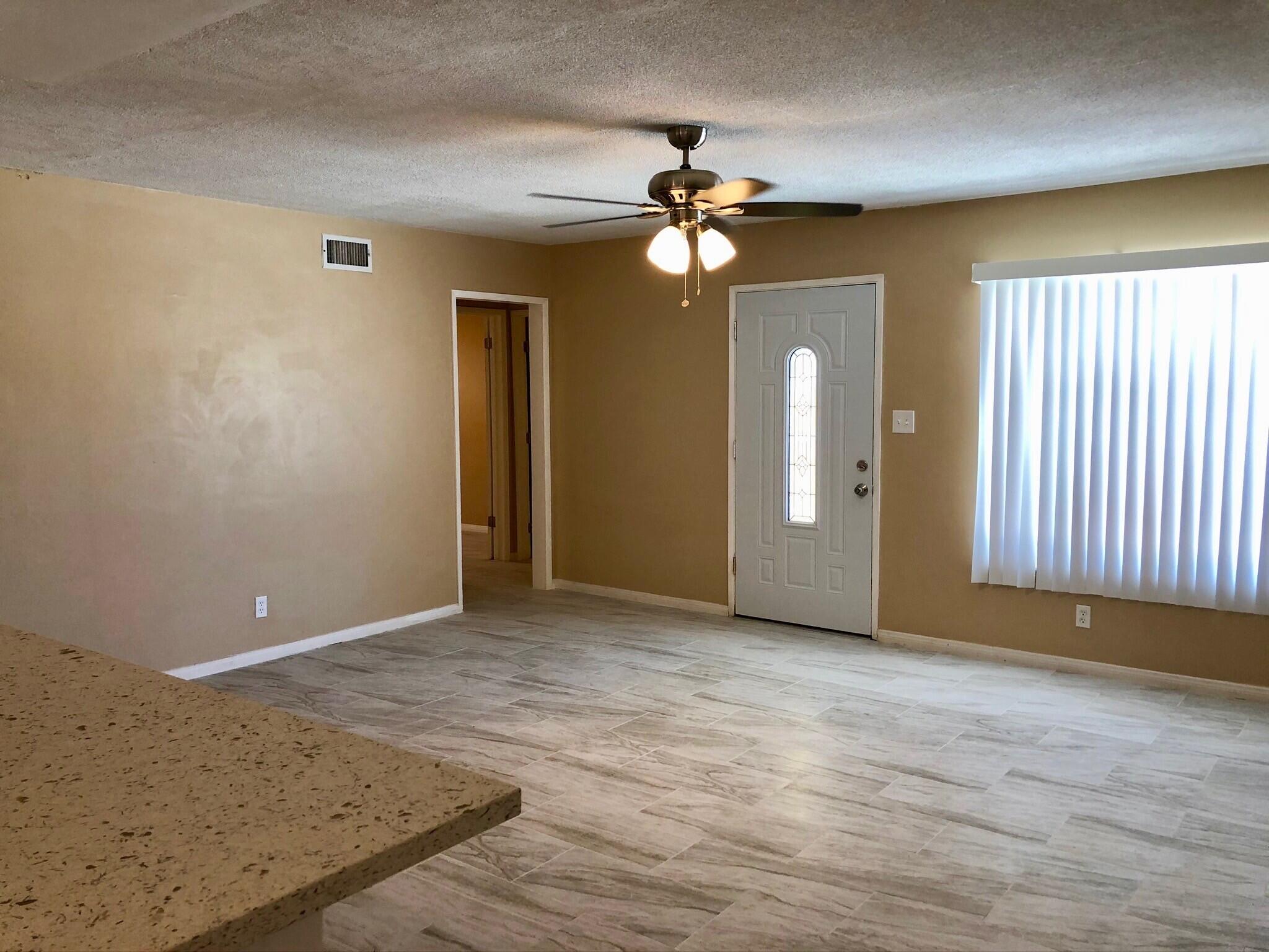 81104 Francis Avenue Indio, CA 92201 - Photo 10 of 23 wooden floor in an empty room with a window