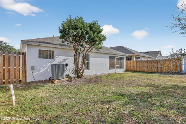 a house with trees in the background