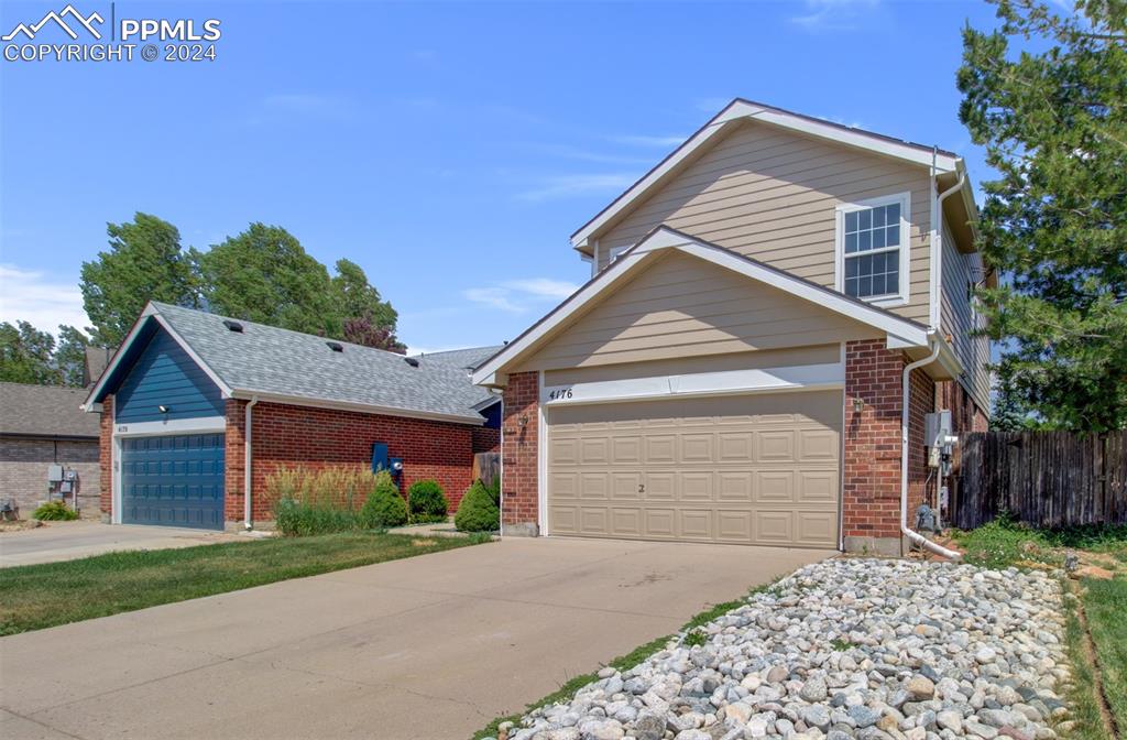 4176 South Himalaya Way Aurora, CO 80013 - Photo 2 of 27 View of front of home with a garage