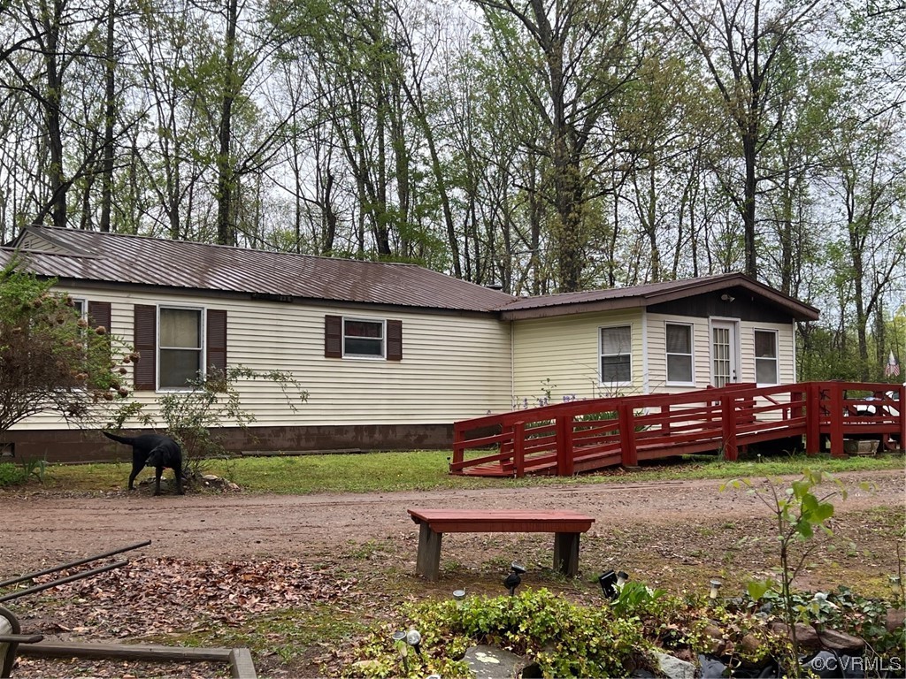 1092 Saunders Lane Meherrin, VA 23954 - Photo 1 of 19 a front view of a house with a garden