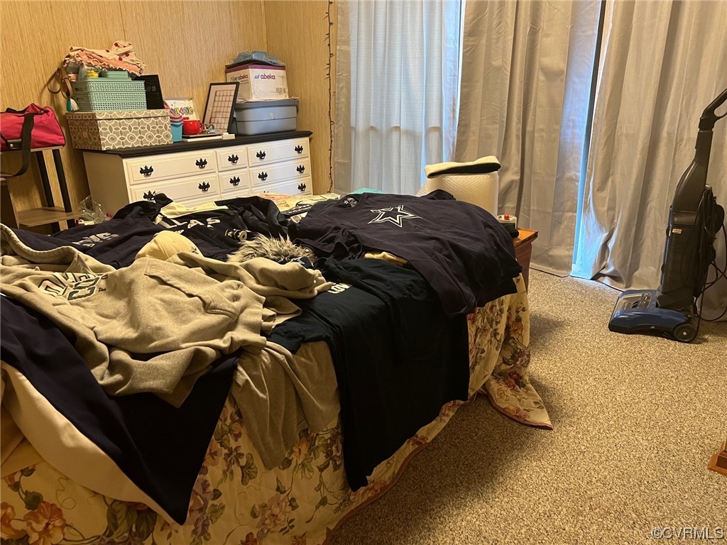 1092 Saunders Lane Meherrin, VA 23954 - Photo 12 of 19 a bed sitting in a bedroom next to a window