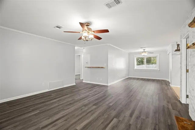 a bathroom with a double vanity sink toilet and shower