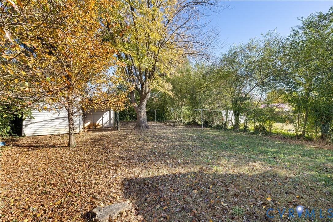 3423 Reynolds Road Richmond, VA 23223 - Photo 19 of 26 a view of a yard with trees