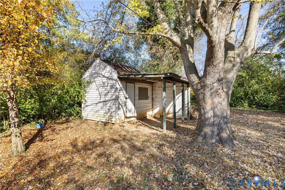 3423 Reynolds Road Richmond, VA 23223 - Photo 20 of 26 a view of a yard with a tree