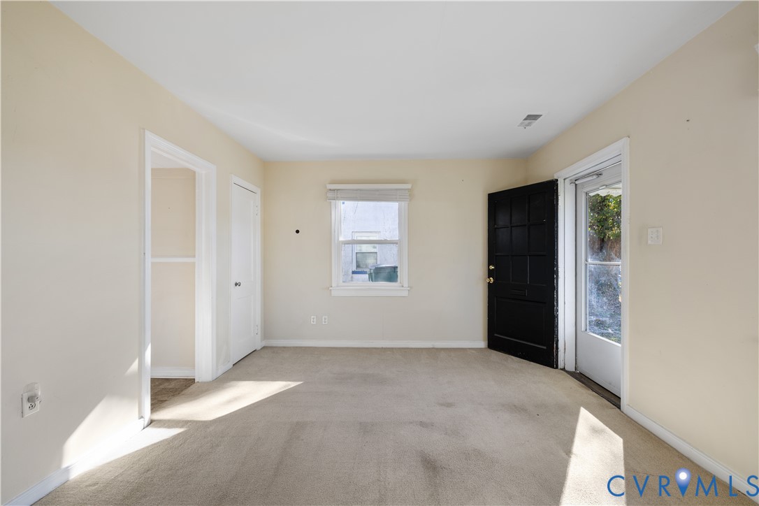 3423 Reynolds Road Richmond, VA 23223 - Photo 4 of 26 an empty room with windows
