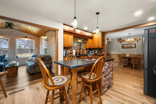a view of a dining room with furniture window and wooden floor