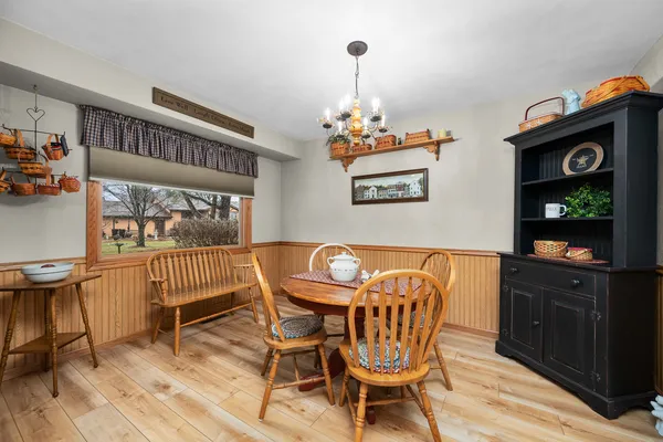 a dining room with furniture and window