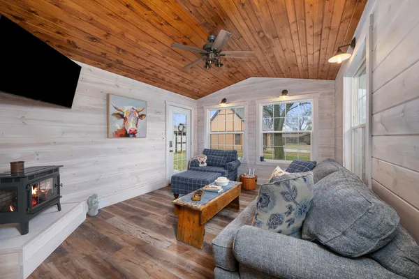 a living room with furniture and a flat screen tv