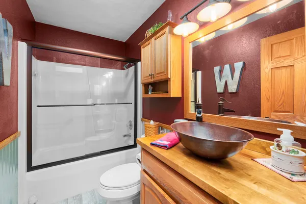 a bathroom with a sink and a large mirror