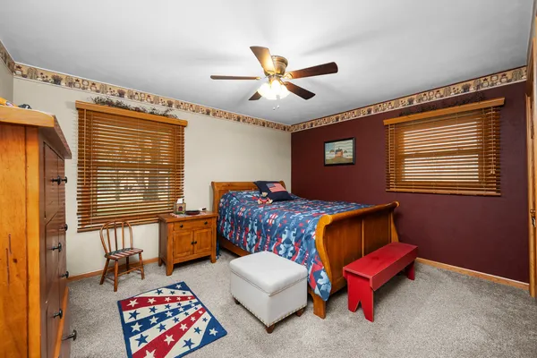 a bedroom with furniture and a window