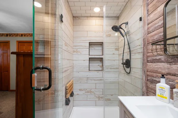 a bathroom with a sink toilet and shower