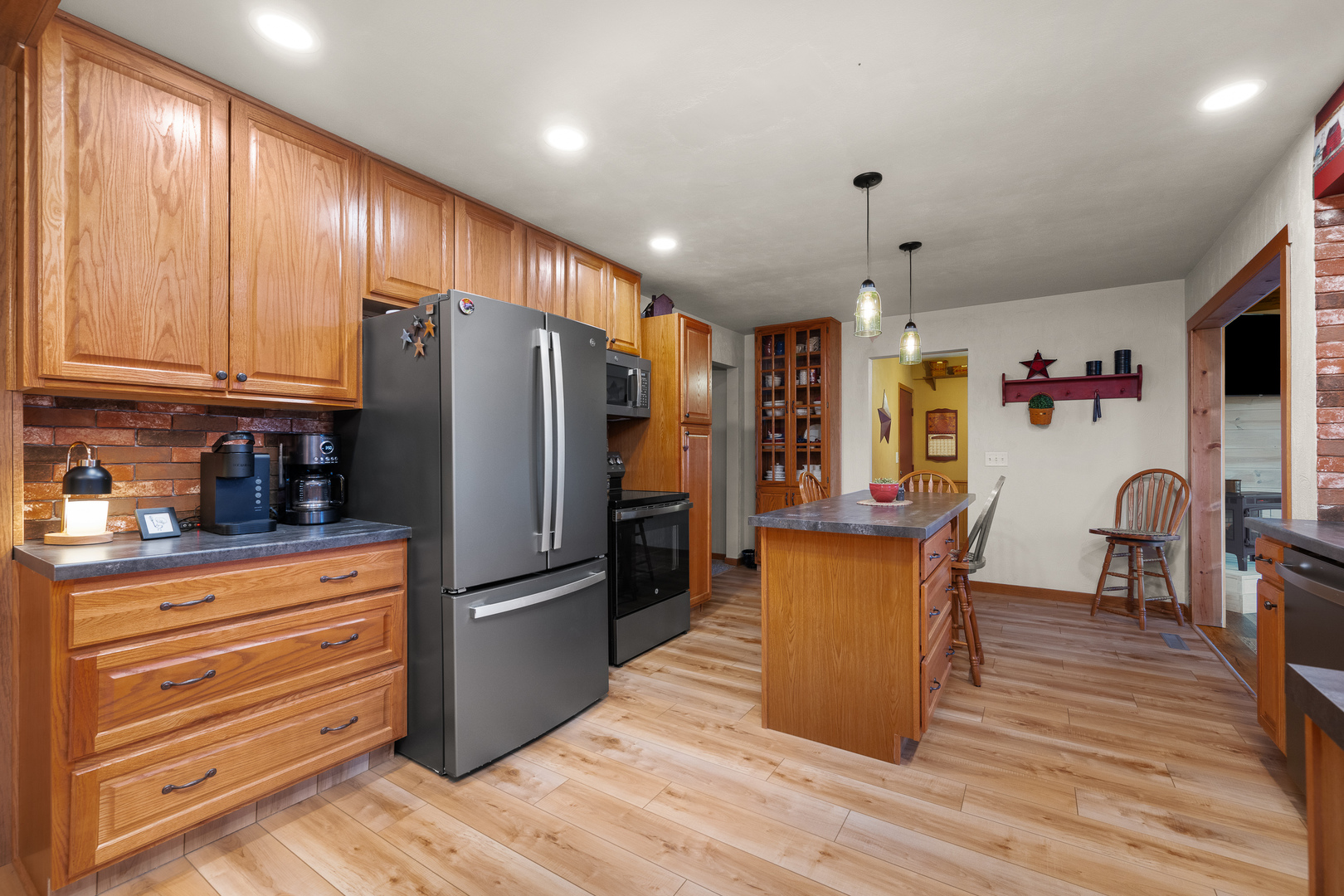 10 Pine Tree Court Kewanee, IL 61443 - Photo 6 of 39 a kitchen with stainless steel appliances granite countertop a refrigerator stove microwave and cabinets