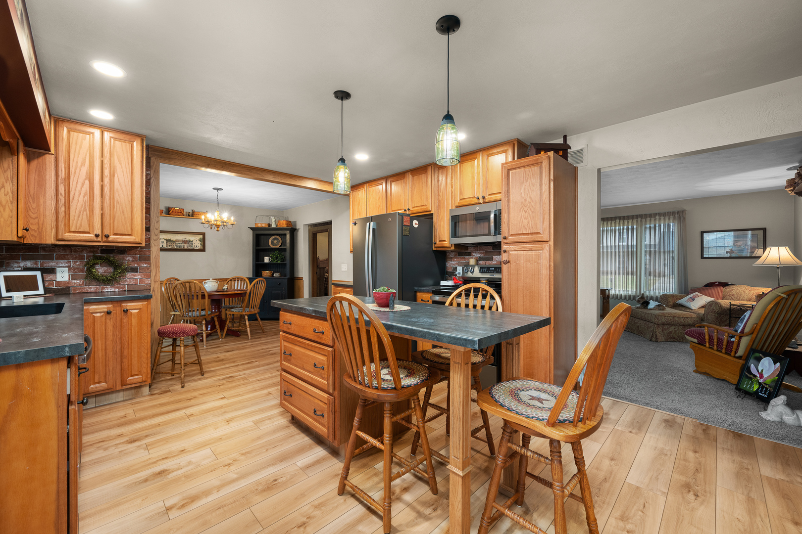 10 Pine Tree Court Kewanee, IL 61443 - Photo 7 of 39 a view of a dining room with furniture window and wooden floor