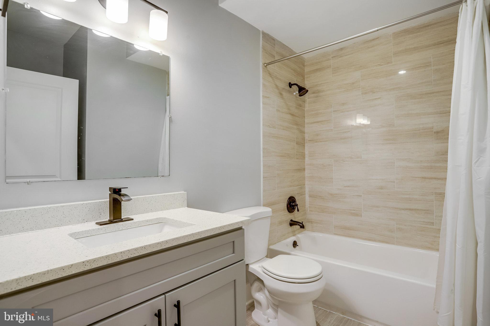1225 Raum Street Northeast, Unit 1 Washington, DC 20002 - Photo 11 of 22 Two Full Bathrooms