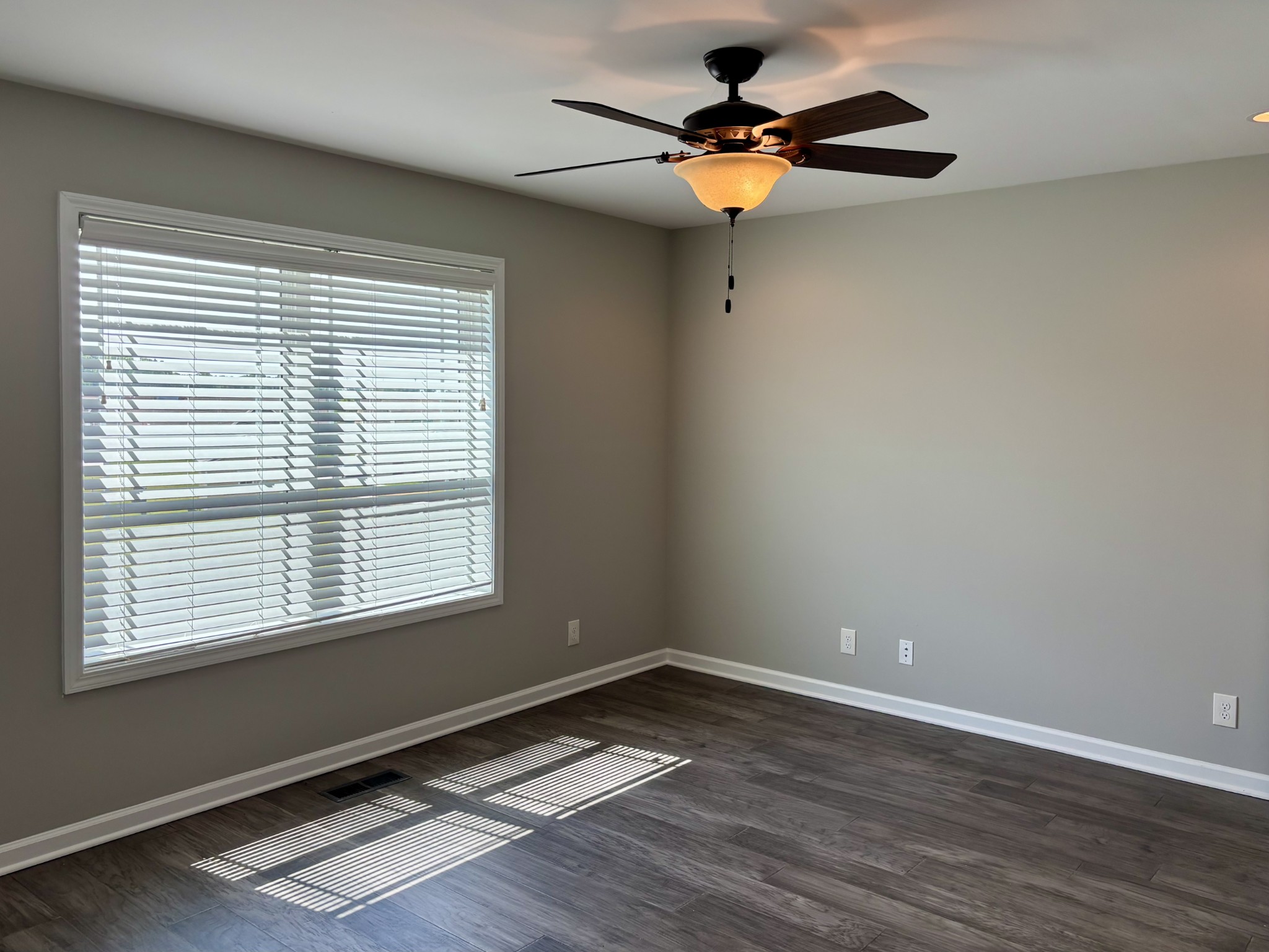 51 Regency Place Manchester, TN 37355 - Photo 9 of 27 a view of an empty room with wooden floor and a window