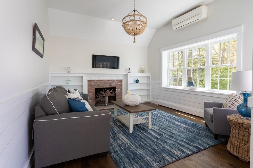 3 Kalmia Way Barnstable, MA 02632 - Photo 12 of 26 a living room with furniture a fireplace and a large window