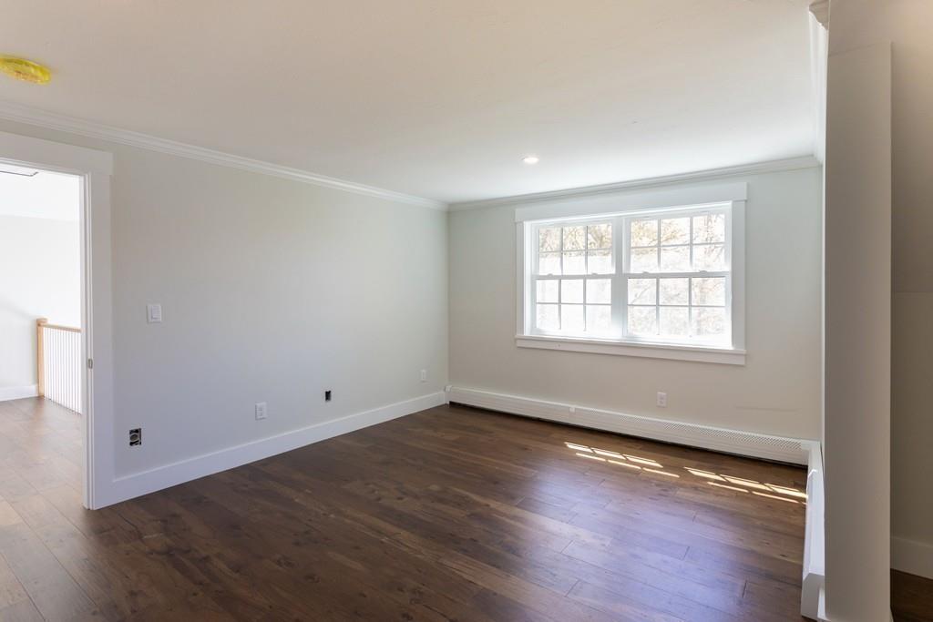 3 Kalmia Way Barnstable, MA 02632 - Photo 18 of 26 an empty room with wooden floor and windows