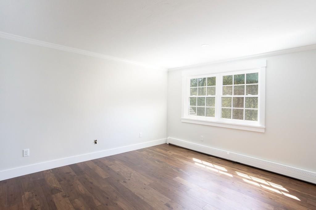 3 Kalmia Way Barnstable, MA 02632 - Photo 19 of 26 an empty room with wooden floor and windows