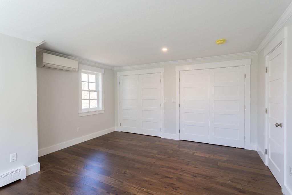 3 Kalmia Way Barnstable, MA 02632 - Photo 20 of 26 wooden floor in an empty room with a window