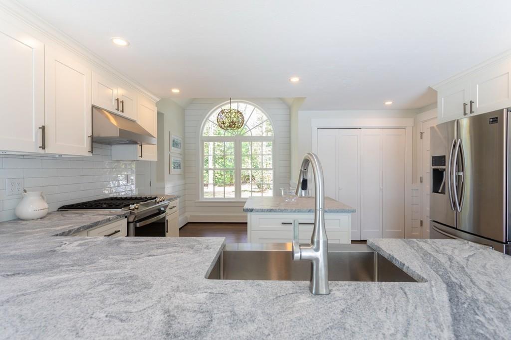 3 Kalmia Way Barnstable, MA 02632 - Photo 6 of 26 a kitchen with stainless steel appliances granite countertop a sink stove and refrigerator