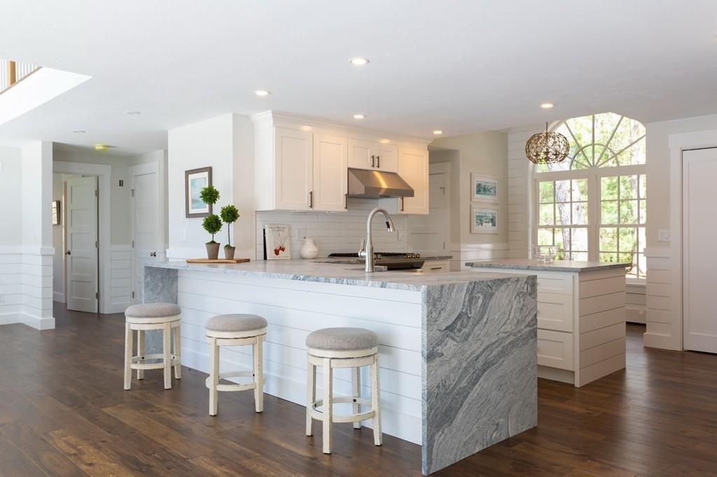 3 Kalmia Way Barnstable, MA 02632 - Photo 7 of 26 a kitchen with kitchen island granite countertop a sink and a stove top oven