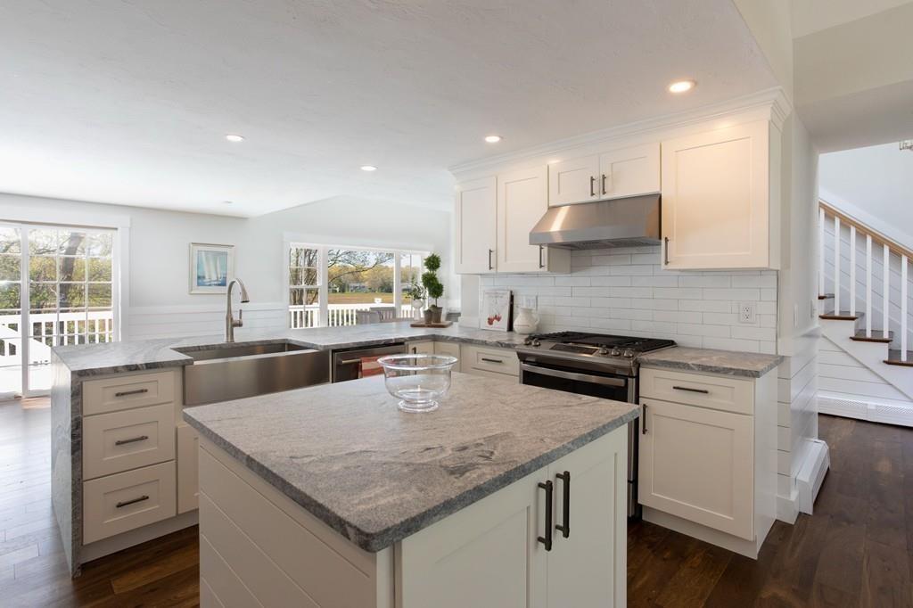 3 Kalmia Way Barnstable, MA 02632 - Photo 9 of 26 a kitchen with stainless steel appliances granite countertop a stove a sink and a refrigerator