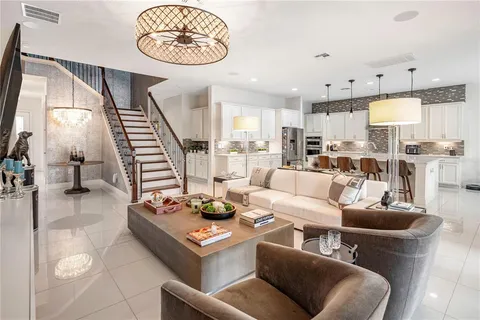 a kitchen with counter top space a sink and appliances