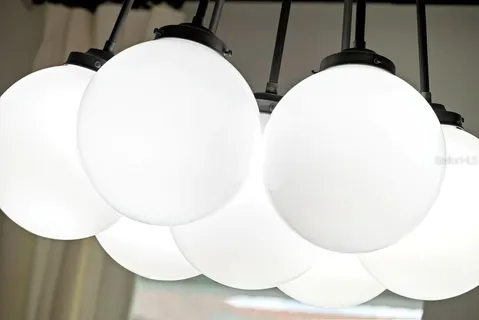 a bedroom with a bed and a lamp