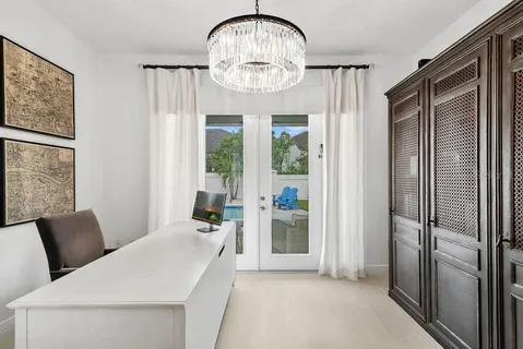 a spacious bedroom with a bed a couch and dresser