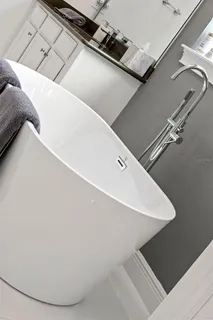 a view of a dining room with furniture and windows