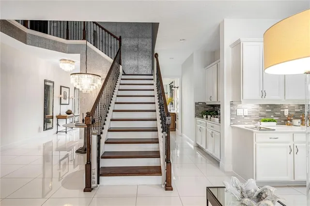 a front view of a house with a garden and plants